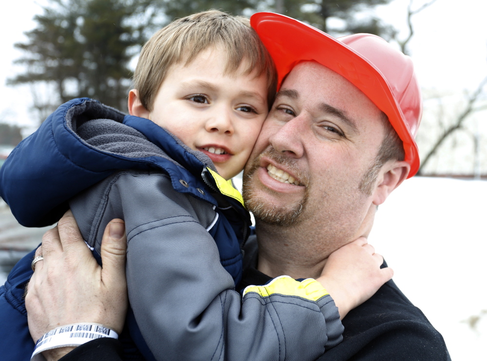 Jon Tanguay and his son Nicholas, 4, shown together in Bath on Friday, escaped a fire Thursday at their home at 62 South St. “I couldn’t see a thing (because of the smoke),” Tanguay said. “Luckily, I was able to hold him.”