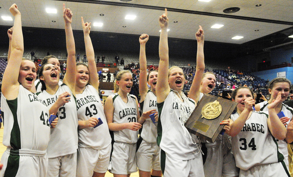 Celebrate good times: Carrabec Cobras celebrate after winning the Class C West girls championship game over Madison on Saturday February 22, 2014 at Augusta Civic Center.