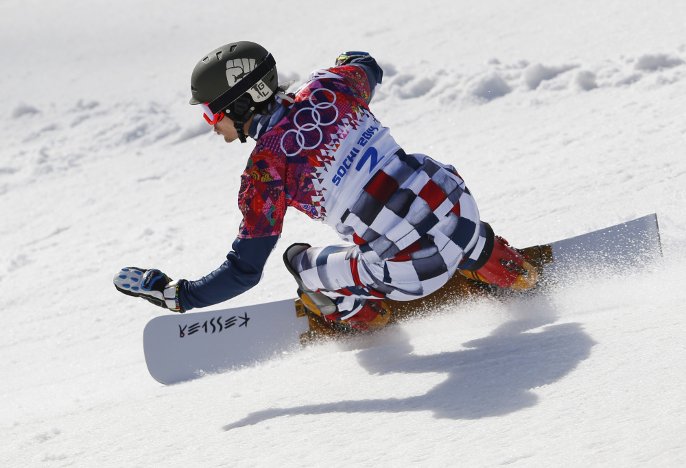 Russia’s Vic Wild competes during snowboard parallel slalom qualifying at the Rosa Khutor Extreme Park at the 2014 Winter Olympics on Saturday in Krasnaya Polyana, Russia.