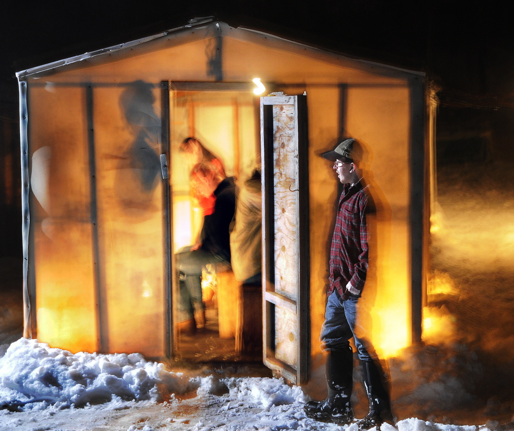 Not enough fish: Andy James walks by shacks Wednesday at Baker’s Smelt Camps in Pittson. Baker’s is closing early this winter because of a terrible catch of rainbow smelt, which biologists say may be the worst on record.