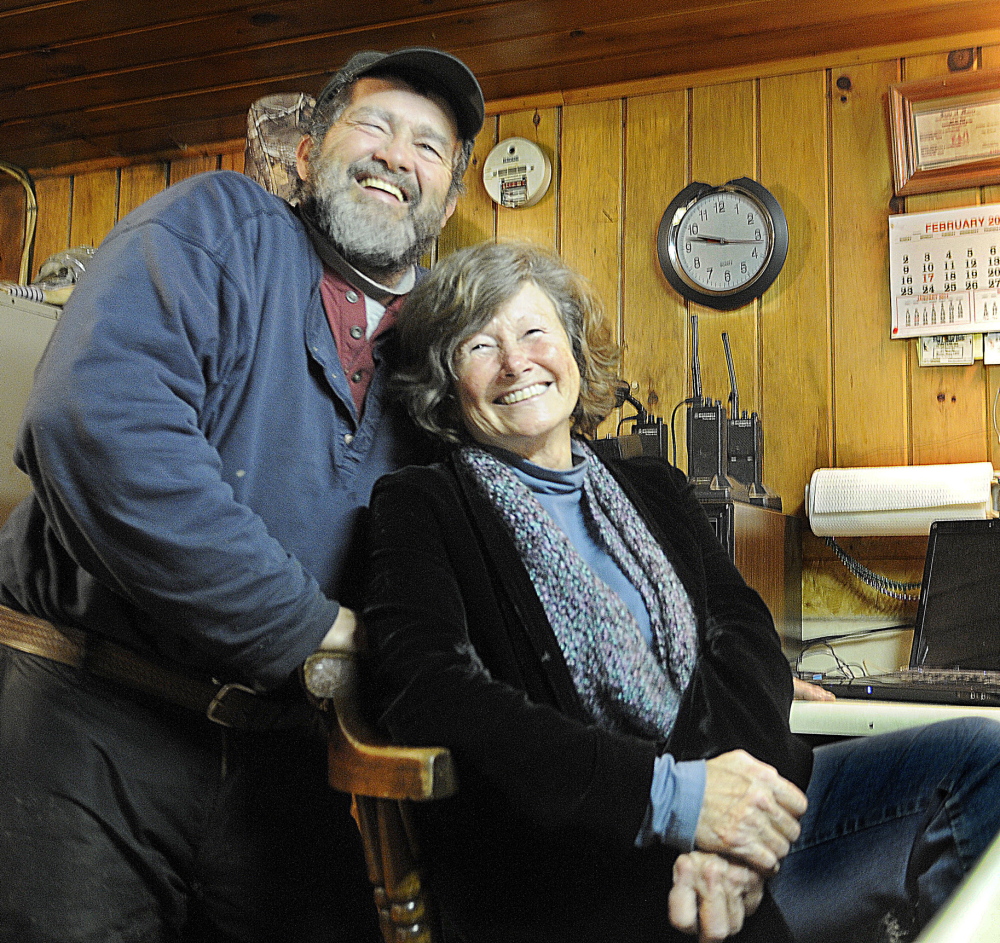 CUT BAIT: Mike Baker and his partner Cindy Lougee wait on a customer Wednesday at Baker’s Smelt Camps in Pittston. Baker’s is closing early this year because of a lack of rainbow smelt in the Kennebec River.