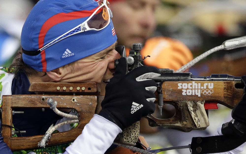 United States’ Russell Currier of Stockholm, Maine, shoots during the men’s biathlon 4x7.5K relay at the 2014 Winter Olympics Saturday in Krasnaya Polyana, Russia.
