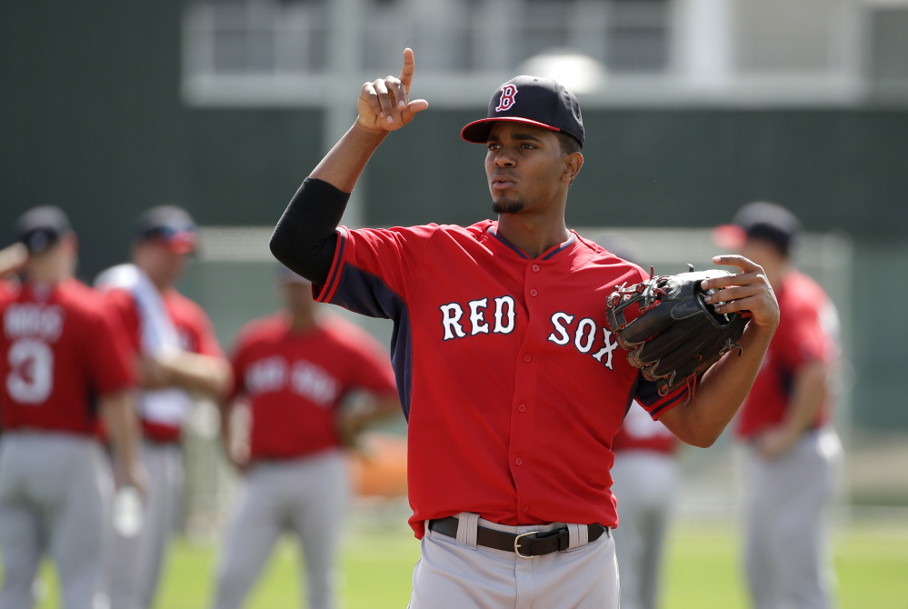JOB HUNTING: Boston Red Sox shortstop Xander Bogaerts works out on the field during spring training Thursday in Fort Myers, Fla. Bogaerts feels he still needs to prove himself to win the shortstop starting job.