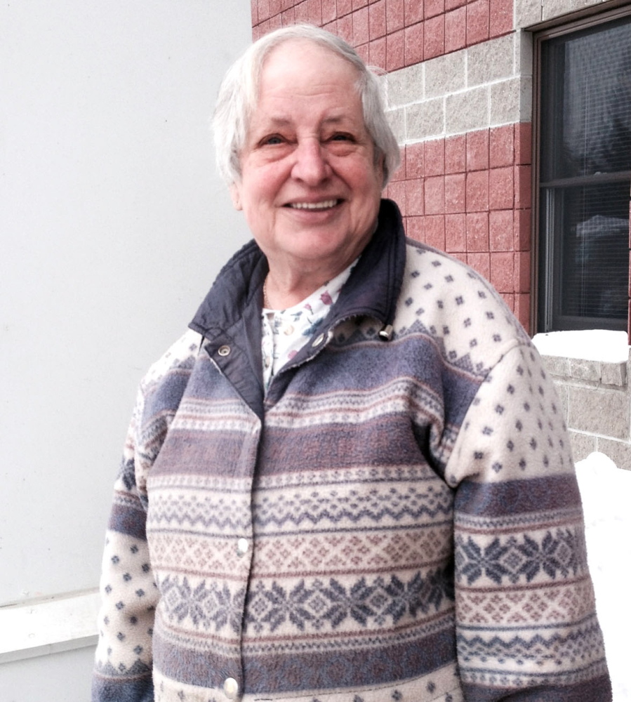 NO DEMISE YET: Shirley Beaver stands outside the U.S. Social Security office in Waterville.