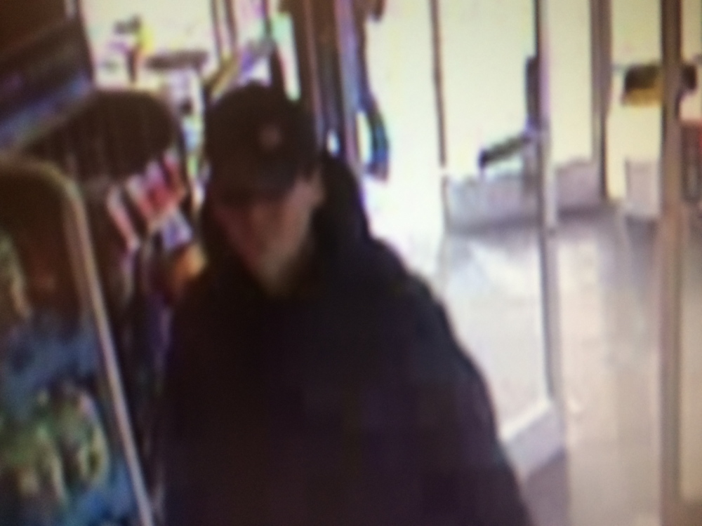 DAYLIGHT ROBBERY: Security camera footage shows a suspect in a robbery at Rite Aid pharmacy in Winslow Monday.
