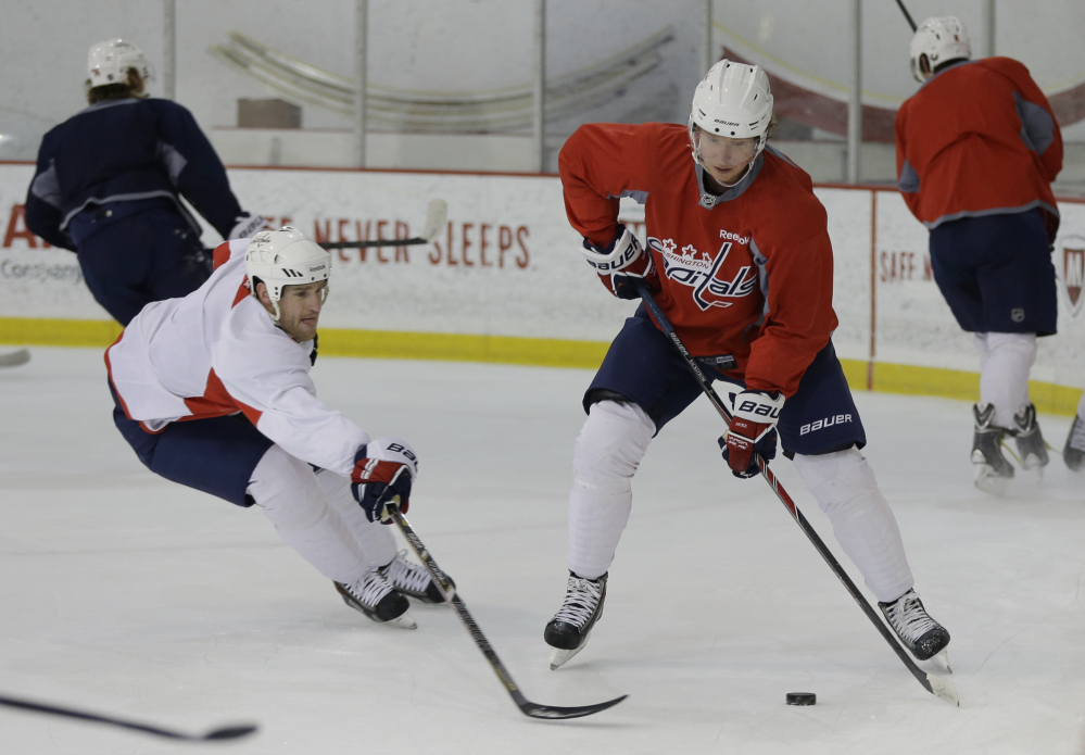 BACK TO WORK: Washington Capitals center Nicklas Backstrom, right, works out Tuesday during practice in Arlington, Va. The league is back and running after a three-week break due to the Winter Olympics.