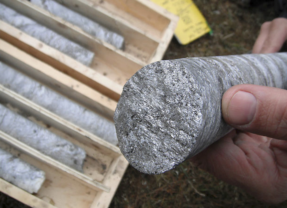 A technician holds a graphite core sample drilled near Graphite Creek, a mineral claim being explored by Graphite One Resources north of Nome, Alaska.