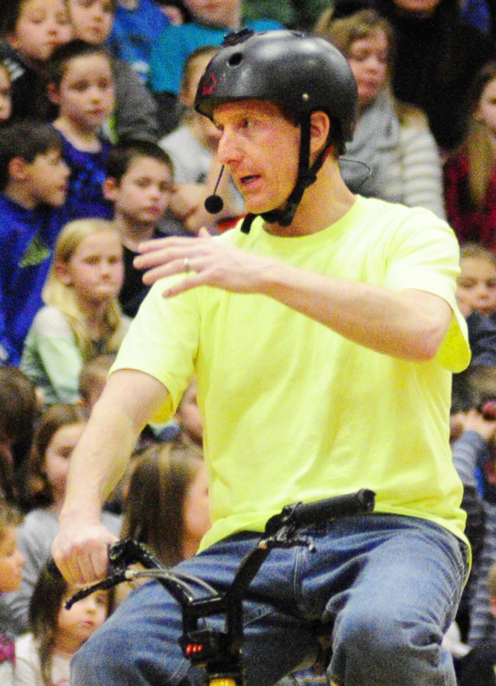 LIFE TRICKS: World Champion Bicycle Stunt Rider, Motivational Speaker and Author Chris Poulos’s talks to Cottrell School students in the Foster Memorial Gym at Monmouth Academy about bullying and other topics on Friday.