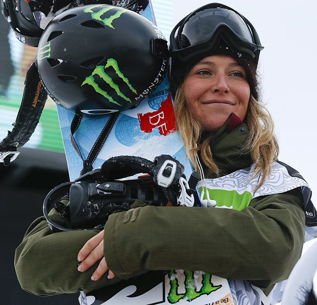 Jamie Anderson stands on the podium after winning the women's slopestyle snowboarding final at the Dew Tour iON Mountain Championships, Friday, Dec. 13, 2013, in Breckenridge, Colo.