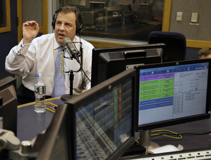 New Jersey Gov. Chris Christie sits in a studio during his radio program, "Ask the Governor" broadcast on NJ 101.5, Monday, Feb. 3, 2014, in Ewing, N.J. During the program, Christie took questions from callers for the first time in more than three weeks as his campaign looked for a way to pay for lawyers as a political payback scandal continues.