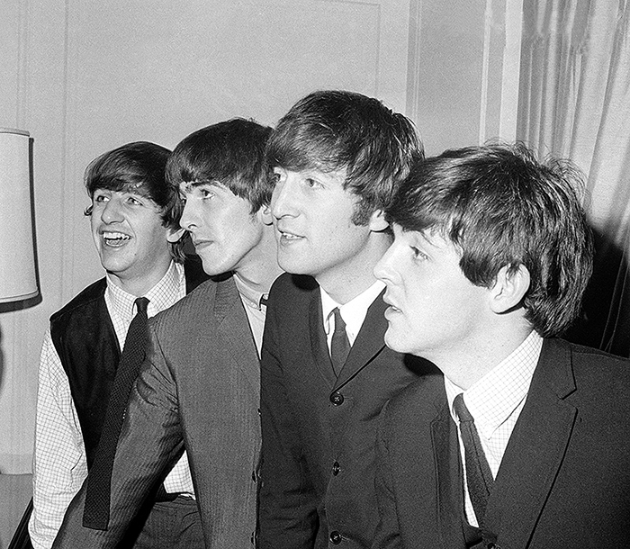The Beatles, from left, Ringo Starr, George Harrison, John Lennon and Paul McCartney, are shown in their New York hotel after their arrival on Feb. 7, 1964. Nine days later, the Beatles made their second TV appearance on the Ed Sullivan Show, which was broadcast live from the Napoleon Ballroom of the Deauville Hotel in Miami Beach.