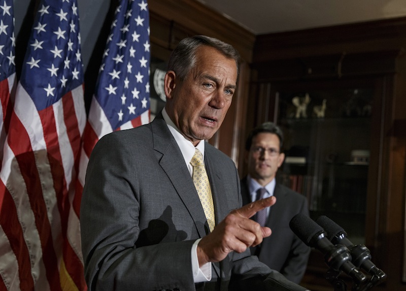 Speaker of the House John Boehner, R-Ohio, and House Majority Leader Eric Cantor, R-Va., at right, talk with reporters in January after a GOP strategy session. House Republican leaders are struggling to devise a way forward on must-do legislation to increase the government's borrowing cap.