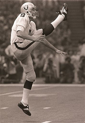 Oakland Raiders punter Ray Guy kicks during the Super Bowl in New Orleans in 1981. Guy set a league record with 619 punts in a row without having one blocked. NFL
