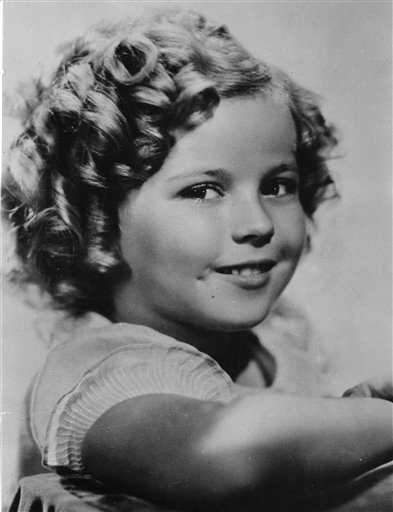 Shirley Temple was 8 years old in this 1936 photo. Publicist Cheryl Kagan says Temple, known in private life as Shirley Temple Black, died at age 85 surrounded by family at her home near San Francisco.