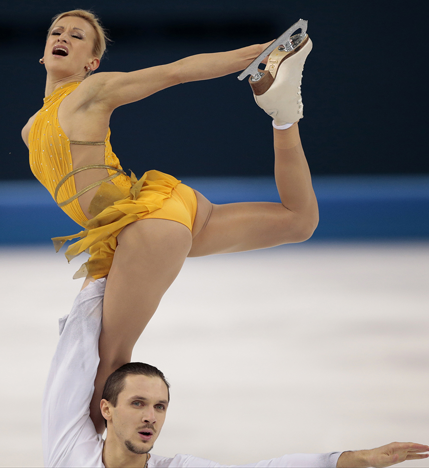 Tatiana Volosozhar and Maxim Trankov of Russia compete in the pairs free skate figure skating competition at the Iceberg Skating Palace during the 2014 Winter Olympics, Wednesday, Feb. 12, 2014, in Sochi, Russia.