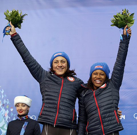 Silver medal winners from the United States Elana Meyers and Lauryn Williams, pose during the flower ceremony during the women's bobsled competition at the 2014 Winter Olympics, Wednesday, Feb. 19, 2014, in Krasnaya Polyana, Russia. (AP Photo/Michael Sohn) 2014 Sochi Olympic Games;Winter Olympic games;Olympic games;Spor