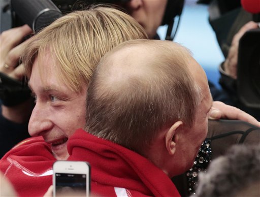 Russian President Vladimir Putin, right, embraces Evgeni Plushenko after Russia placed first in the team figure skating competition at the Iceberg Skating Palace during the 2014 Winter Olympics, Sunday, Feb. 9, 2014, in Sochi, Russia. (AP Photo/Ivan Sekretarev) 2014 Sochi Olympic Games;Winter Olympic games;Olympic games;Sports;Events;XXII Olympic Winter Games
