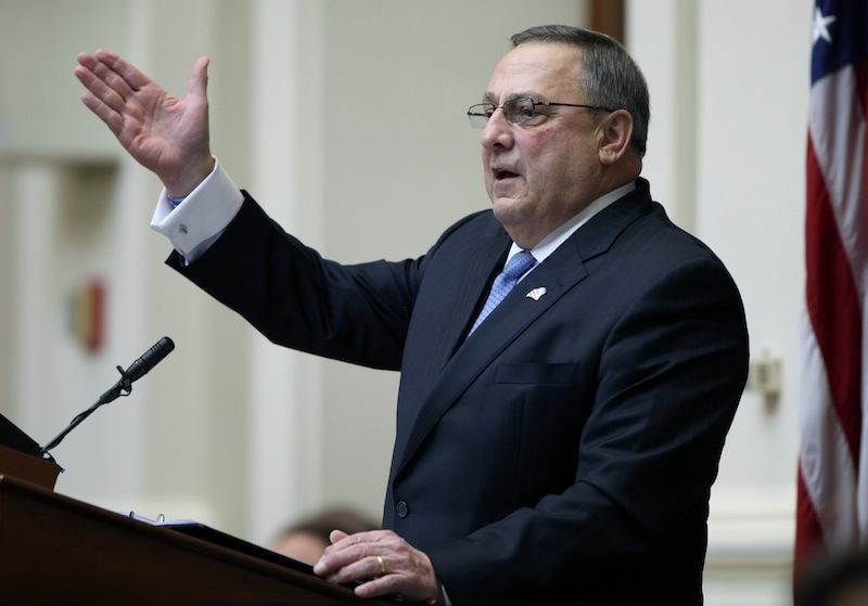 In this Feb. 4 file photo, Gov. Paul LePage gestures as he delivers his State of the State address. By not issuing a veto, Gov. Paul LePage has allowed a bill to prevent a $40 million cut in aid to cities and towns to become law without his signature.