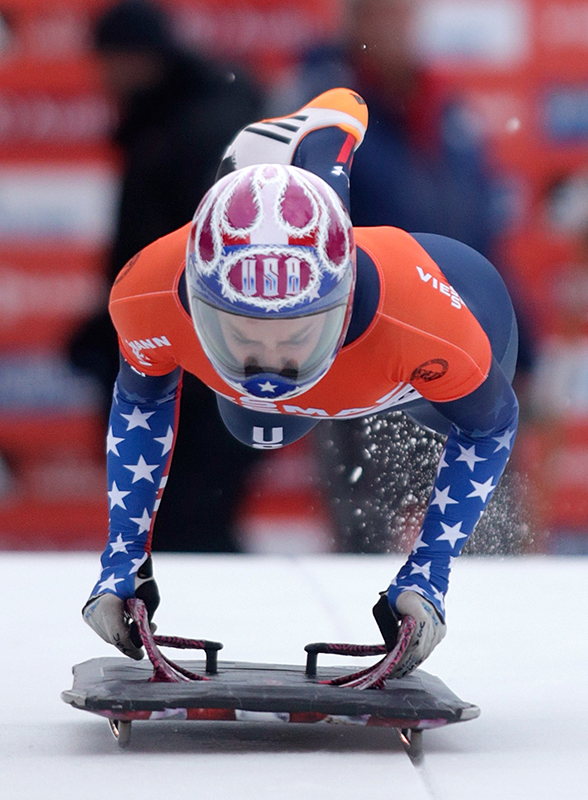 Winner Noelle Pikus-Pace of the U.S. jumps on her sledge during the women's Skeleton World Cup in St. Moritz, Switzerland, on Saturday, January 11, 2014.