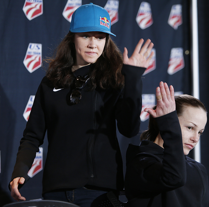 Sarah Hendrickson high fives Lindsey Van as they are announced to be on the U.S. women's ski jumping team at the Utah Olympic Park in Park City, Utah, Wednesday, Jan. 22, 2014. They will shortly leave for the Olympics in Sochi.