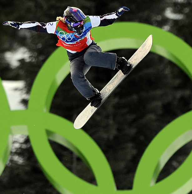 In this Feb. 16, 2010, photo, Lindsey Jacobellis, of the United States, competes during the quarterfinals of the women's snowboardcross at the Vancouver 2010 Olympics in West Vancouver, British Columbia. Gold medals in snowboardcross at the Winter X Games on Friday, Jan. 24, 2014, went to a pair of familiar: Jacobellis and Nate Holland. The perfect way to head over to Sochi, where both will be on the U.S. Olympic team.