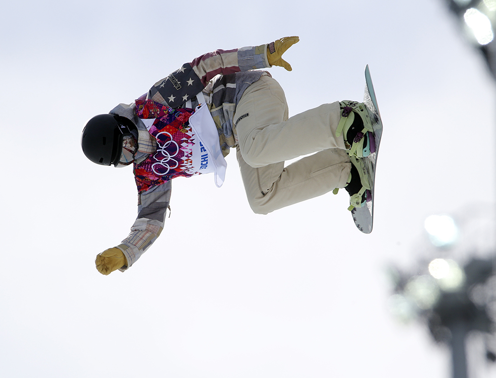 United States' Kelly Clark competes in the women's snowboard half pipe qualifying round at the Rosa Khutor Extreme Park, at the 2014 Winter Olympics, Wednesday, Feb. 12, 2014, in Krasnaya Polyana, Russia.