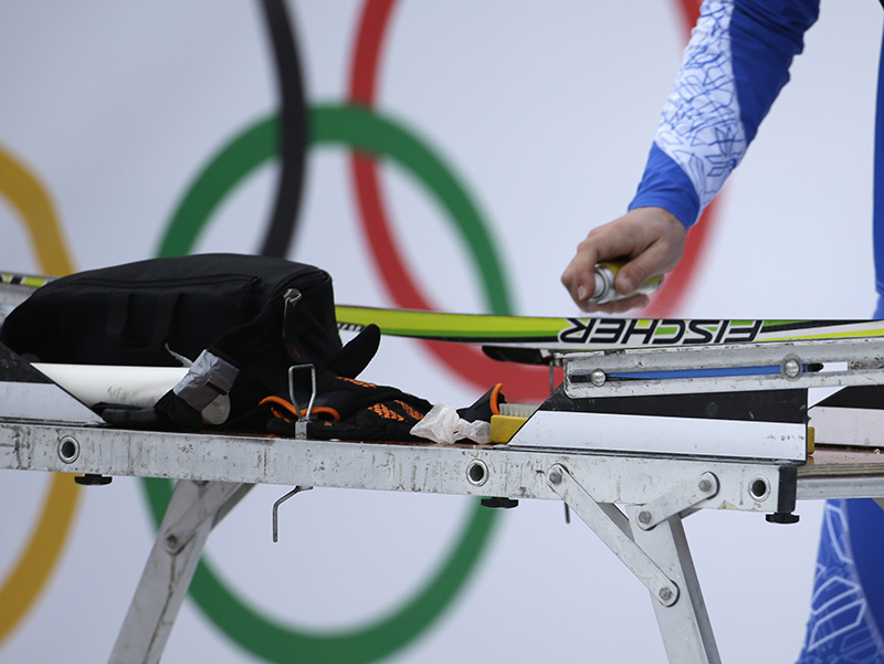 A service technician waxes a ski prior to the cross-country sprint competitions at the 2014 Winter Olympics, Tuesday, Feb. 11, 2014, in Krasnaya Polyana, Russia.