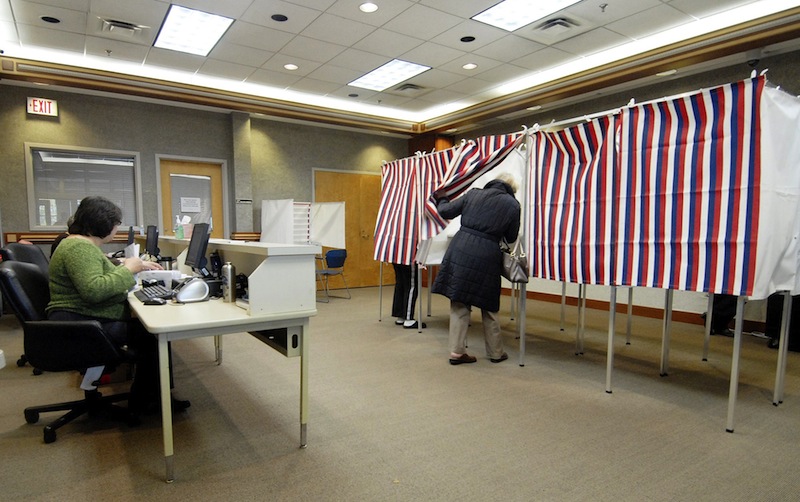In this 2010 file photo, a resident takes advantage of early voting at the Scarborough Municipal Building. A bill proposing a constitutional amendment to allow an enhanced early-voting system in Maine fell short Wednesday in the House of Representatives. Election 2009