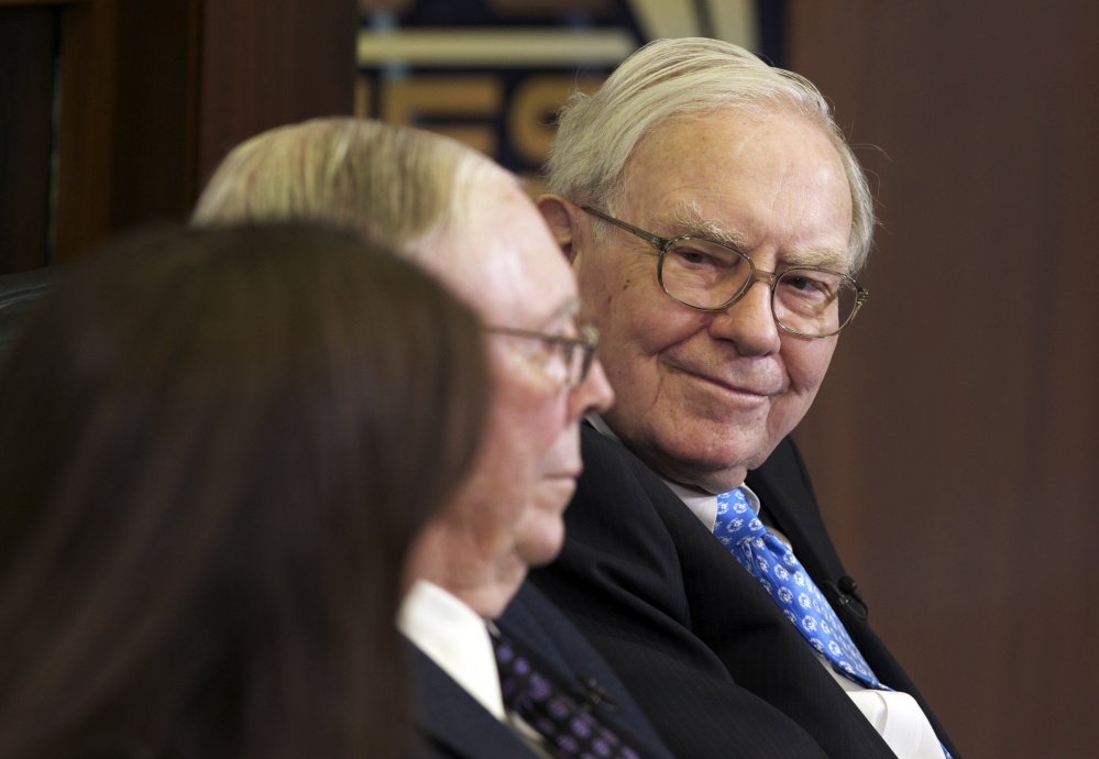 Chairman and CEO Warren Buffett’s Berkshire Hathaway company said on Saturday that fourth-quarter earnings rose 10 percent to nearly $5 billion .