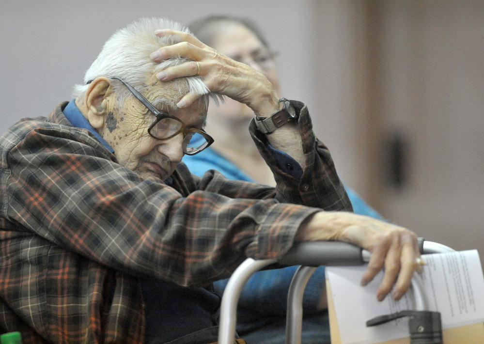 Life Attendant: Laurence Amazeen, 99, listens to the town meeting budget during the annual town meeting at the Cornville town Hall on Saturday. Amazeen also turned 99 on Saturday making him the oldest vote in the meeting.