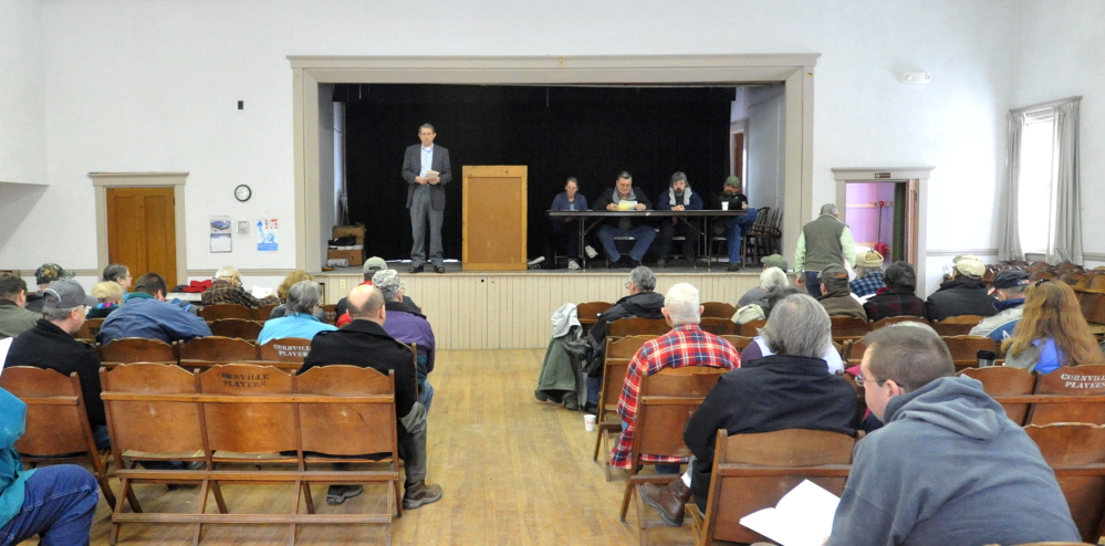 Motion MEETING: Residents of Cornville listen to a motion during the annual Town Meeting at the Cornville Town Hall on Saturday.