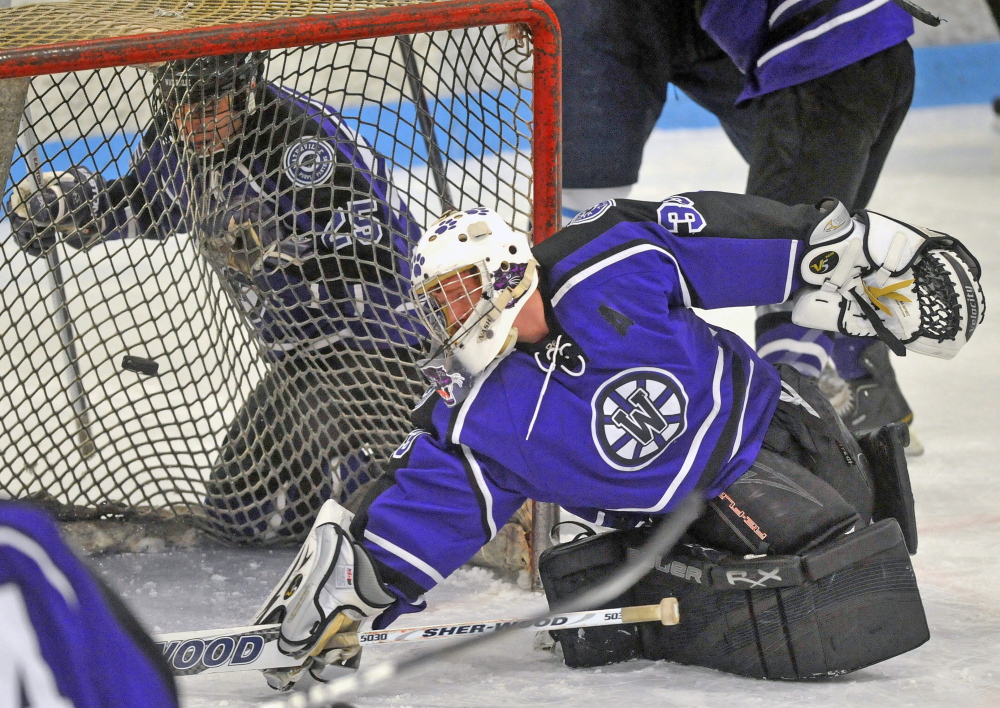 HIGH SCHOOL HOCKEY: Waterville Senior High School goalie Kaleb Kane, 33, tries to make a save against Presque Isle High School at Sukee Arena in Winslow on Saturday. Presque Isle defeated Waterville 5-4.