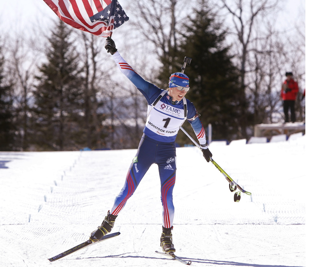 Sean Doherty of Center Conway, N.H., hoists the American flag high as he crosses the finish line in first place with a time of 28:51.8 in the youth men’s 10-kilometer pursuit at the IBU Biathlon Youth/Junior World Championships at the Nordic Heritage Center in Presque Isle on Sunday.