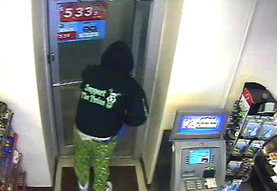 MANHUNT: Surveillance camera photo of suspected armed robber.