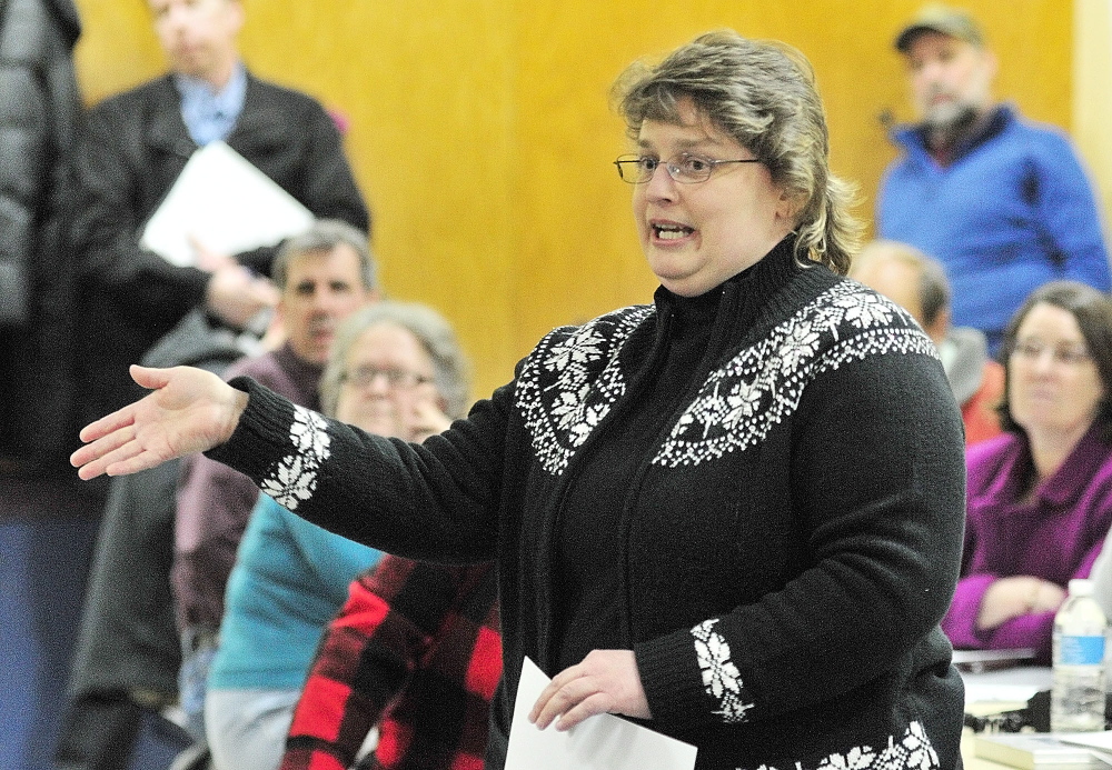 WORRIED ABOUT CRASHES: Paula Gravelle, who said she lives near the West Gardiner service plaza, talks about accidents during a public meeting held Tuesday at Helen Thompson School in West Gardiner by the state Department of Transportation to hear reaction to a planned roundabout.