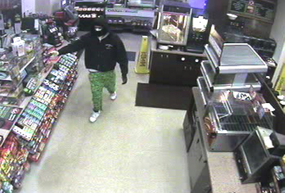 Surveillance camera photo of suspected armed robber.