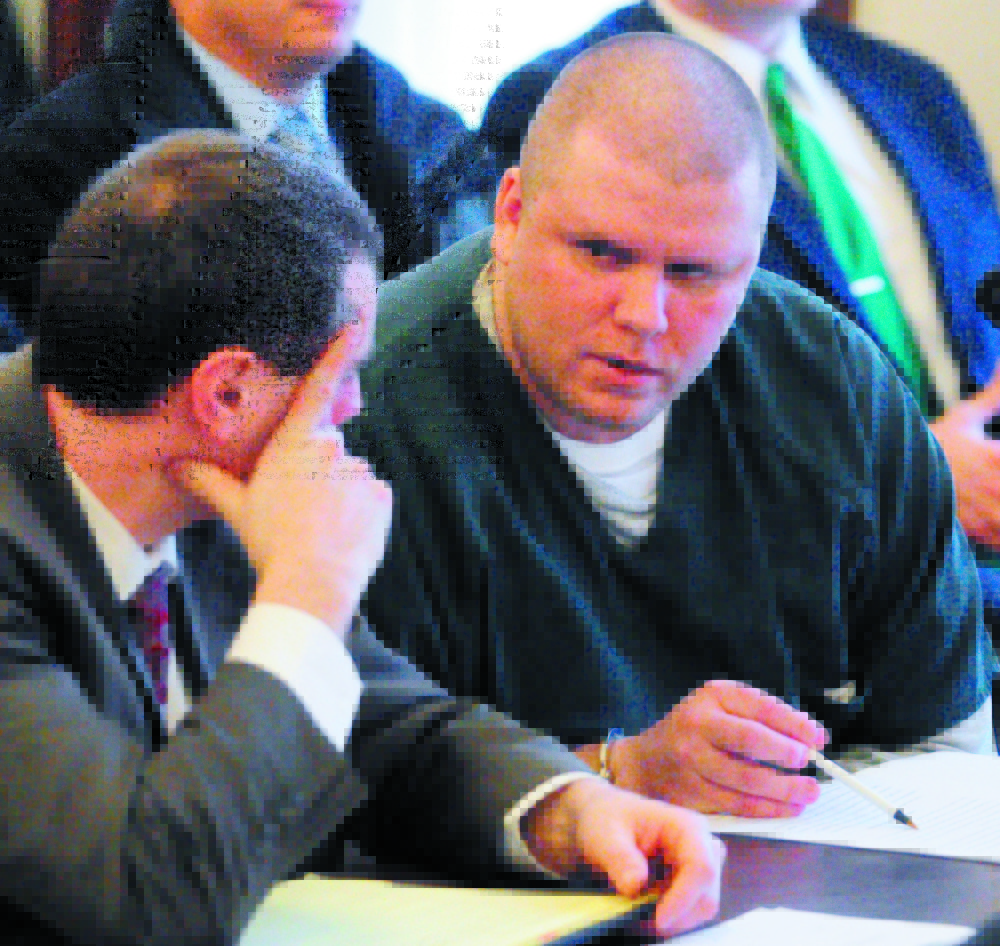 Attorney Kevin Sullivan, left, sits with Peter George Bathgate II during Bathgate’s Jan. 27, 2012, sentencing hearing in Kennebec County Superior Court. Bathgate pleaded guilty to the intentional and knowing murder of Peter Allen and received a 45-year prison sentence. On Thursday, Bathgate was back in court asking for the conviction to be vacated and a new trial.