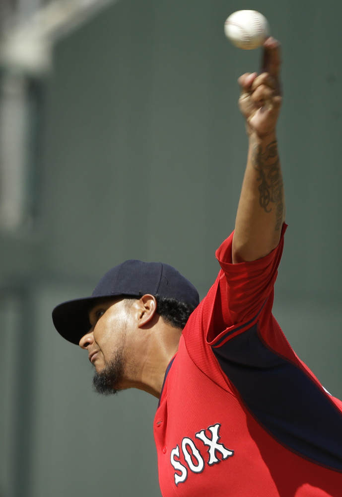 Boston Red Sox pitcher Felix Doubront delivers a warm-up pitch in the fourth inning against the Atlanta Braves on Friday.