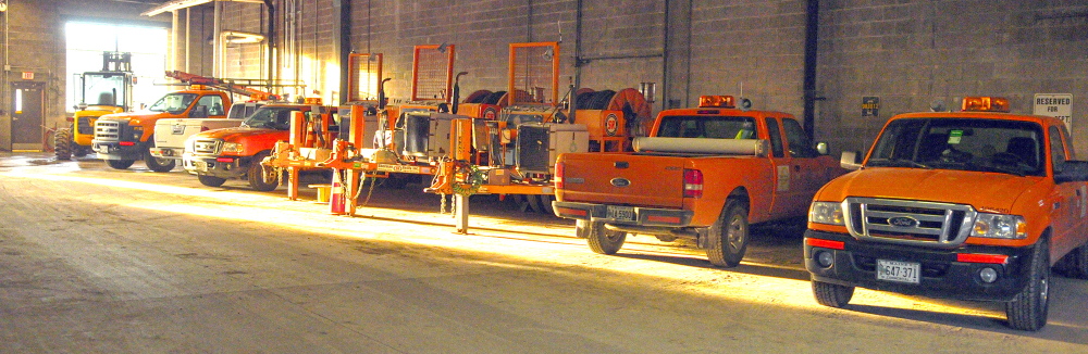 CMP FLEET: Rows of vehicles are parked on Friday at Central Maine Power’s Augusta Service Building on Old Winthrop Road. A bill proposed by a Farmington representative would require CMP to register its vehicles in various towns across the state, which would cost the city hundreds of thousands of dollars, according to city officials.