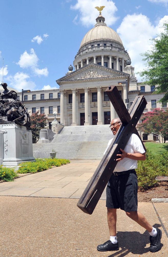 A man heads for a religious gathering outside Mississippi’s Capitol in 2013. A “religious-freedom” bill widely seen as a door to discrimination of gays is being debated in the state.