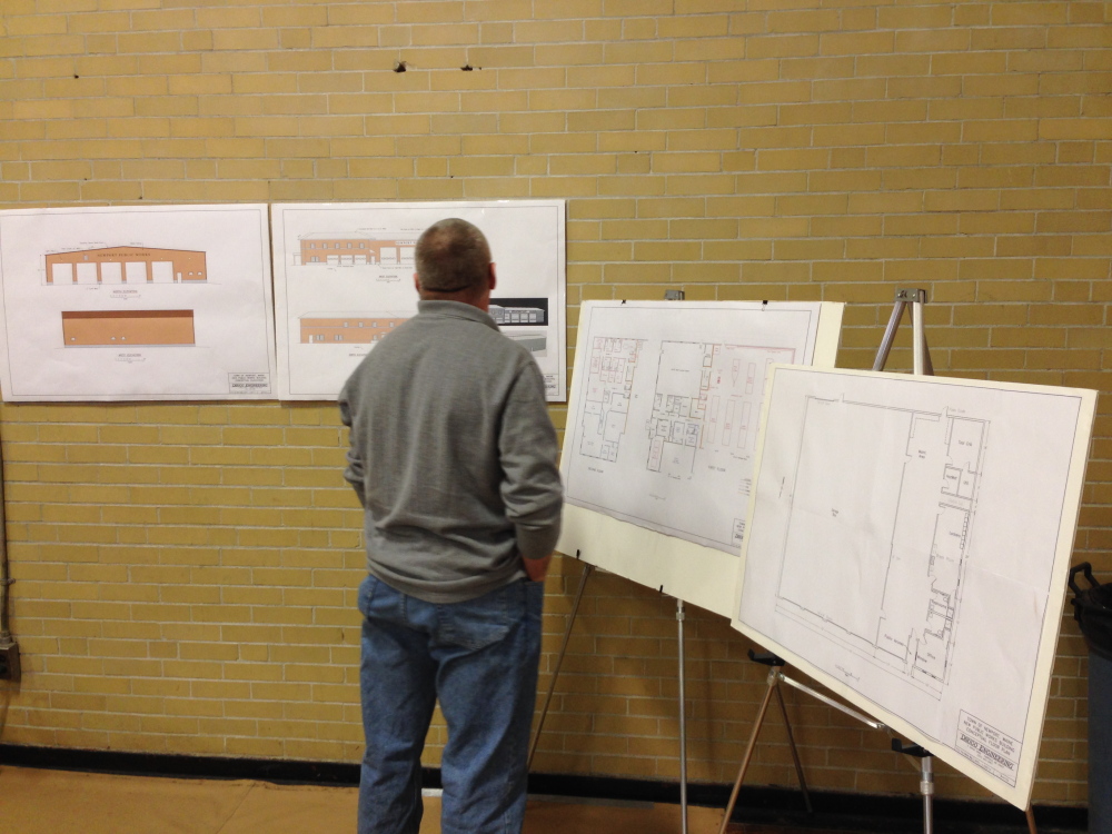 A Newport resident looks over conceptual drawings from Dirigo Engineering of Fairfield of the proposed public works garage and public safety building. Both projects totaling $4.75 million were approved by voters.