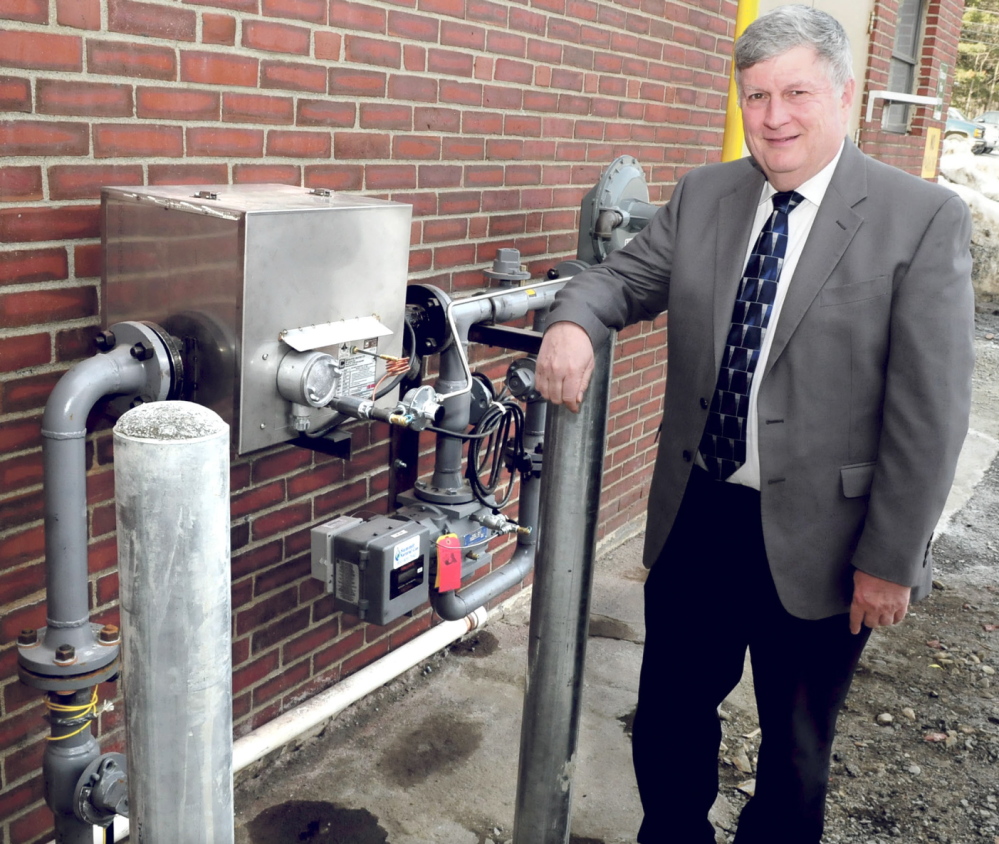 NEW POWER: John Dalton, president of Inland Hospital in Waterville, stands beside a meter where natural gas enters the building on Monday, March 10, 2014. Dalton said natural gas is estimated to save the hospital between $100,000 and $150,000 per year in energy costs.