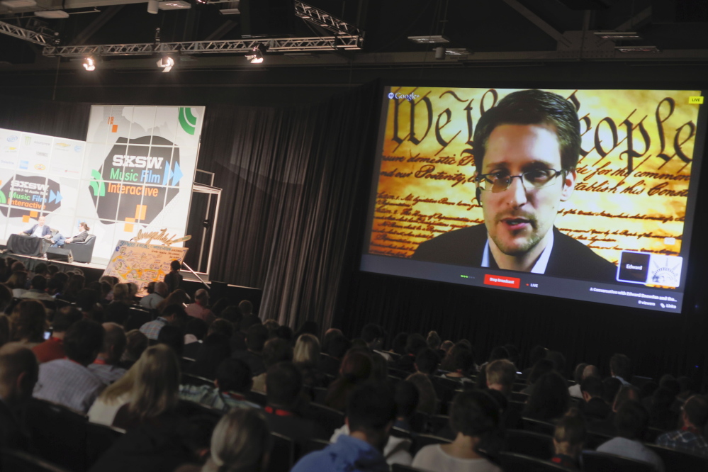 Edward Snowden talks during a simulcast conversation during the SXSW Interactive Festival on Monday in Austin, Texas. Snowden talked with American Civil Liberties Union’s principal technologist Christopher Soghoian, and answered tweeted questions.