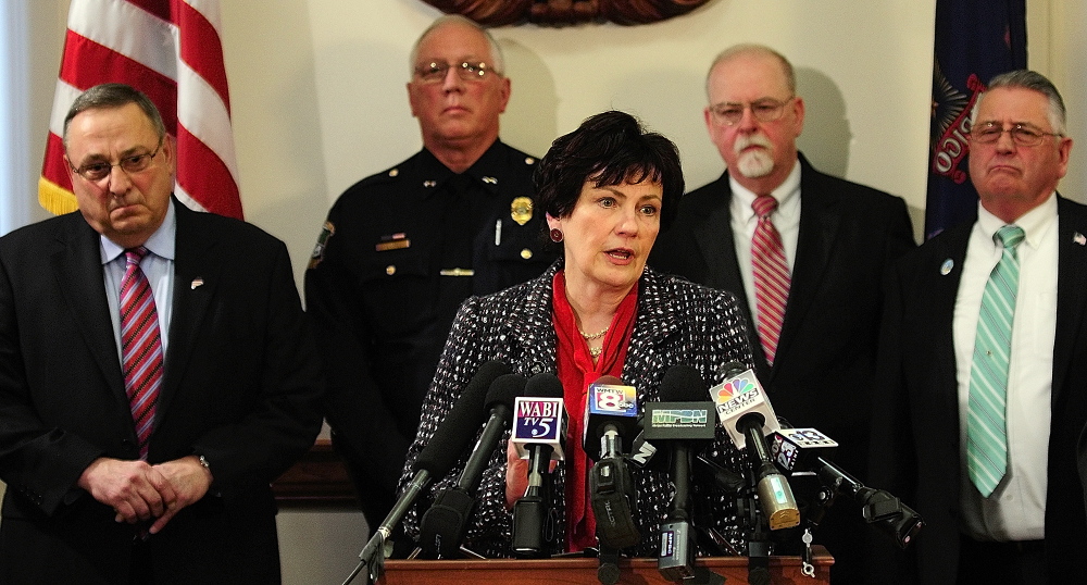 Cumberland County District Attorney Stephanie Anderson speaks during a news conference Tuesday where Gov. Paul LePage, far left, announced his proposal to crack down on drug dealing and drug abuse in the state.