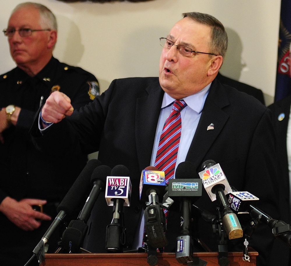Gov. Paul LePage answers questions during a news conference Tuesday about his plan to crack down on drug dealing and abuse.