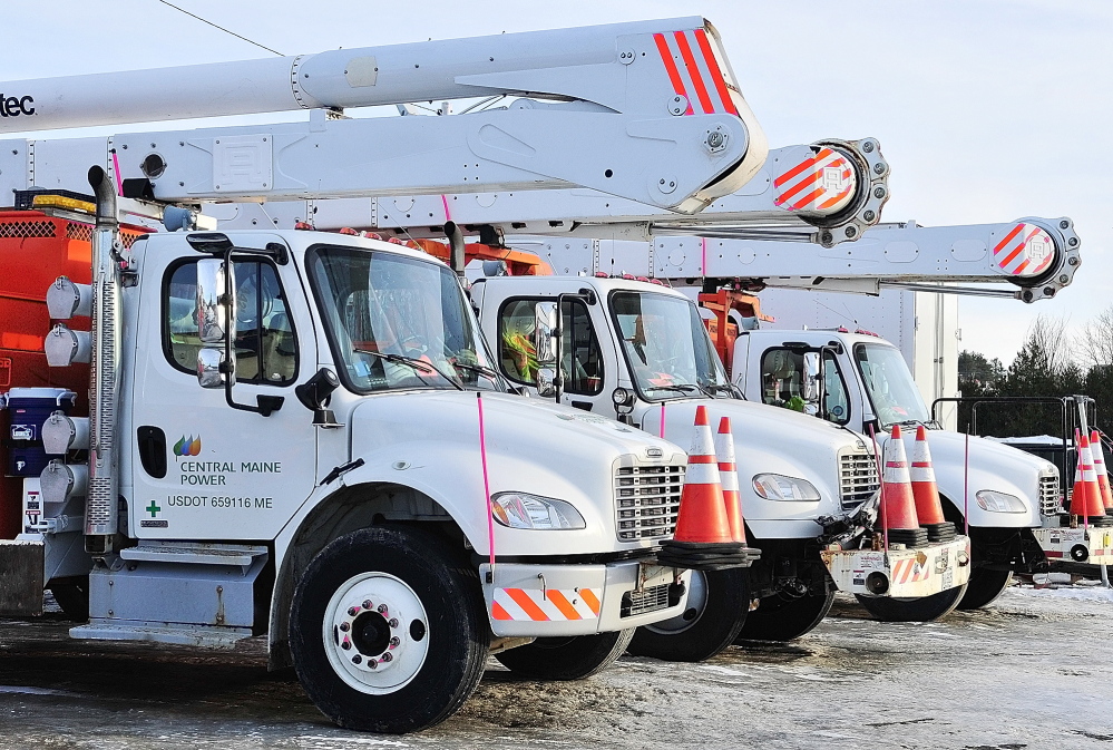 FLEET FIGHT: Rows of vehicles are parked Friday at Central Maine Power Co.’s Augusta Service Building on Old Winthrop Road in Augusta. A bill heard by lawmakers Wednesday would require utilities to register their vehicles where they are parked.
