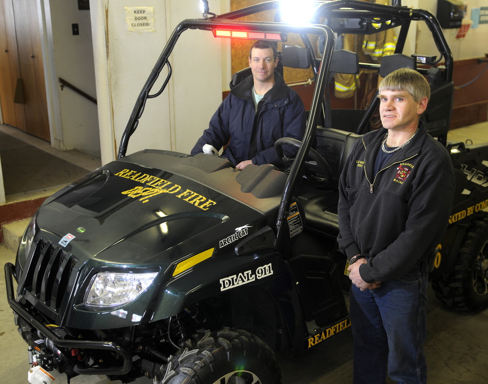 Staff photo Andy Molloy COMMUNITY SUPPORT: Readfield Fire Department Capt. Jason Foster, left, and Chief Lee Mank say the new utility task vehicle the department bought was paid for entirely by money raised by the community.