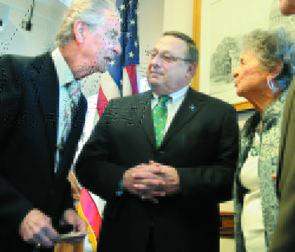 HALL OF FAMER: In this 2012 file photo, Augusta resident Leo Pepin, left, and his sister, Madeline Patenaude, speak with Gov. Paul LePage after LePage signed a bill to designate the “Dirigo March” as the official state march. Next week, Pepin will be inducted into the Franco-American Hall of Fame.