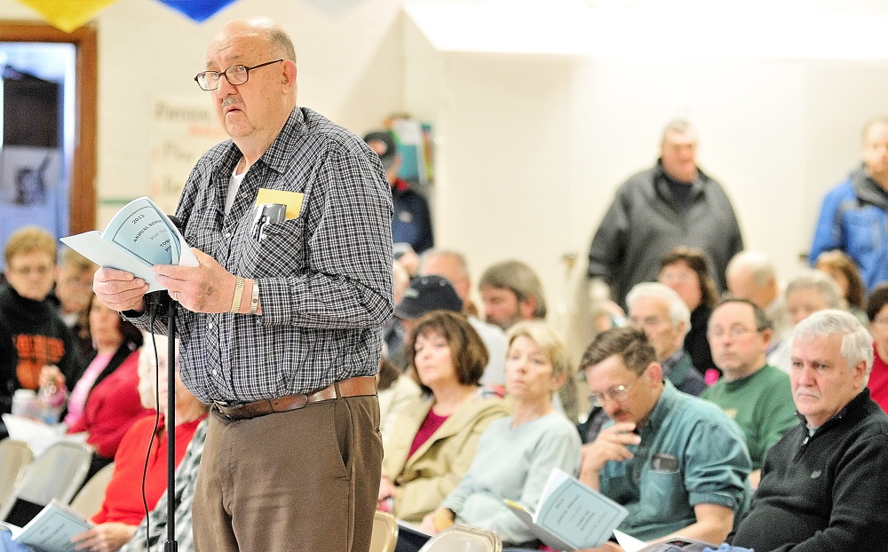 His opinion: Robert Bender speaks on Saturday during a debate at the Pittston Town Meeting in the Pittston Consolidated School.