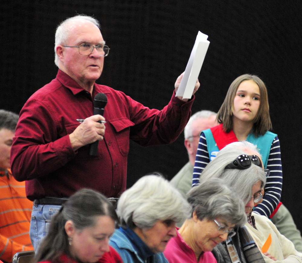 A Voter inquires: Dennis Purington asks a question Saturday during the 2014 Belgrade Town Meeting at the Center For All Seasons.